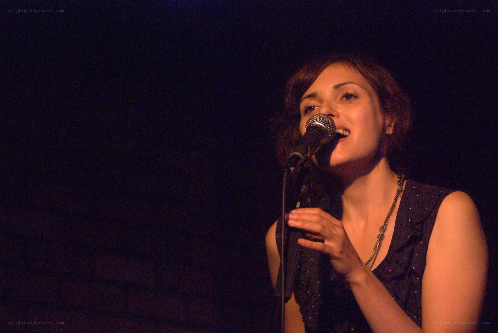 woman singing into microphone