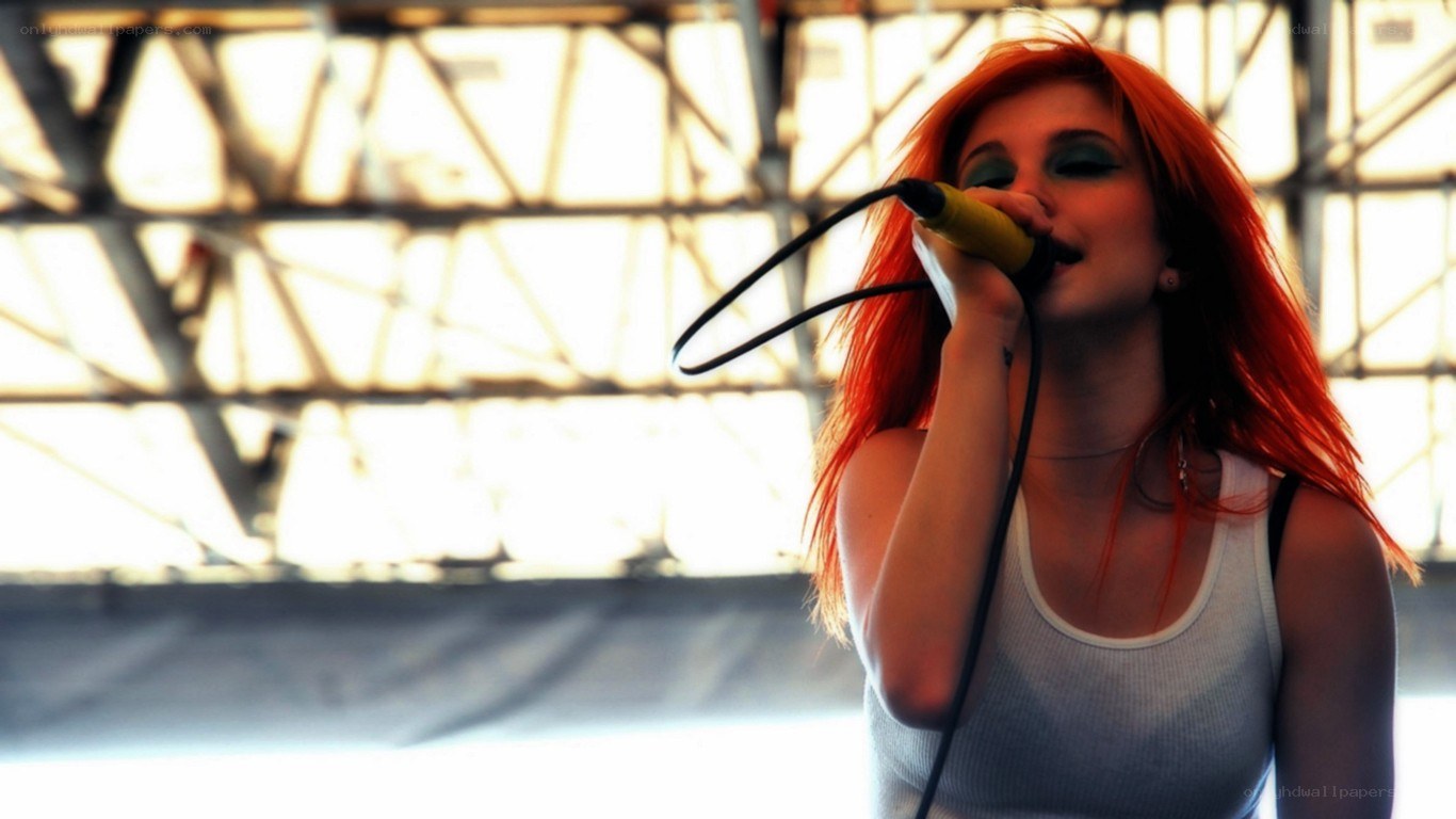 woman singing into microphone
