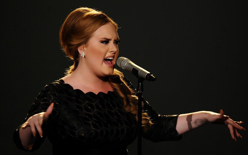 woman singing into microphone