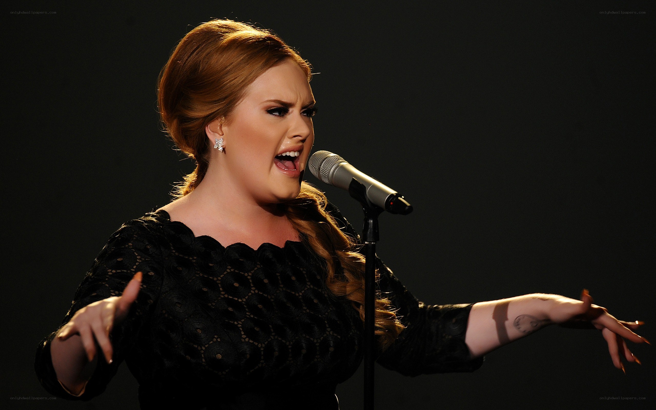 woman singing into microphone
