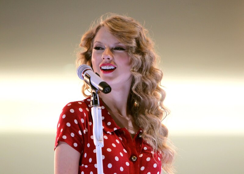 woman singing into microphone