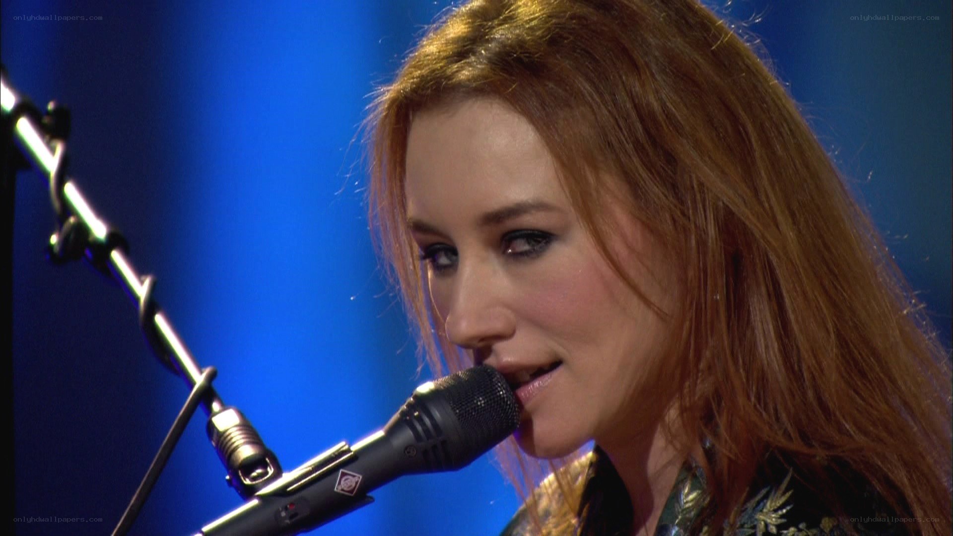 woman singing into microphone