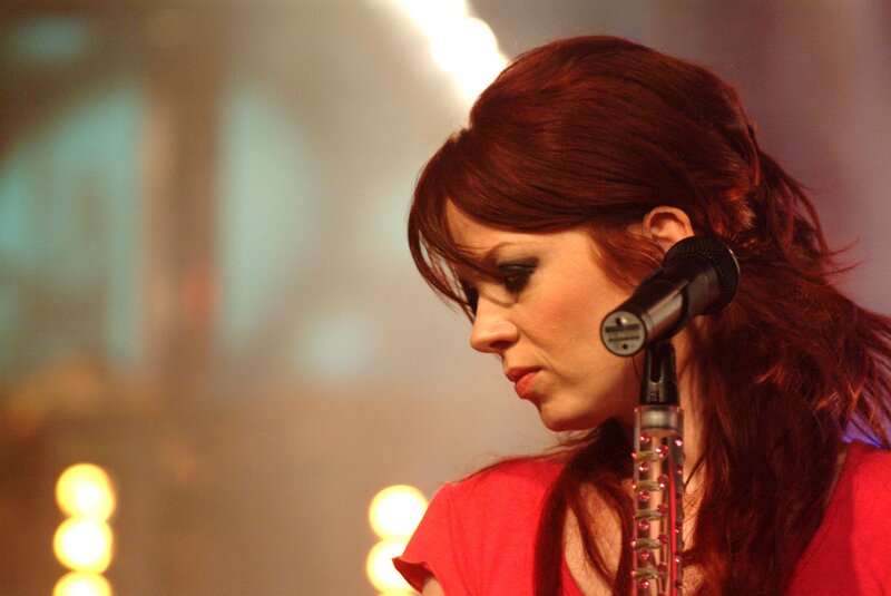 woman singing into microphone