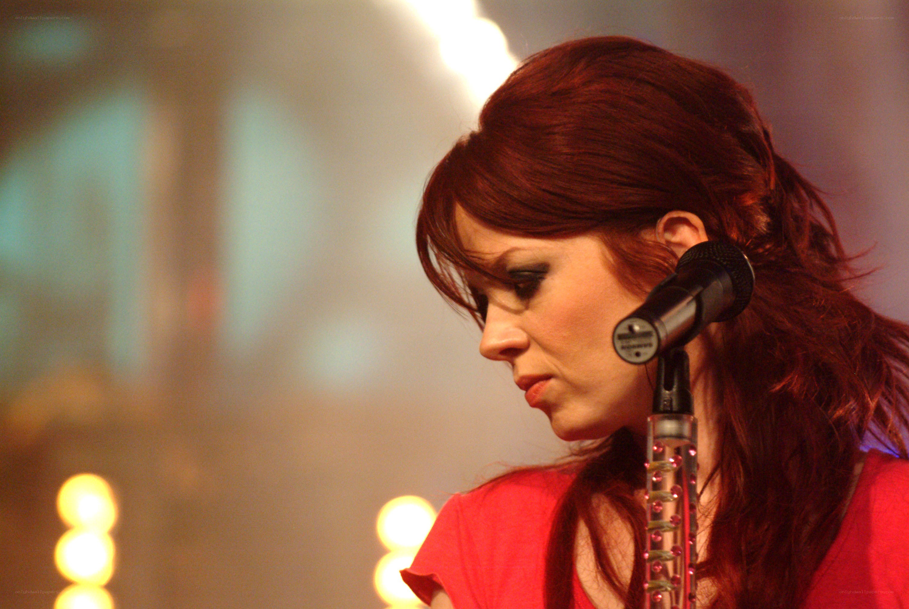 woman singing into microphone