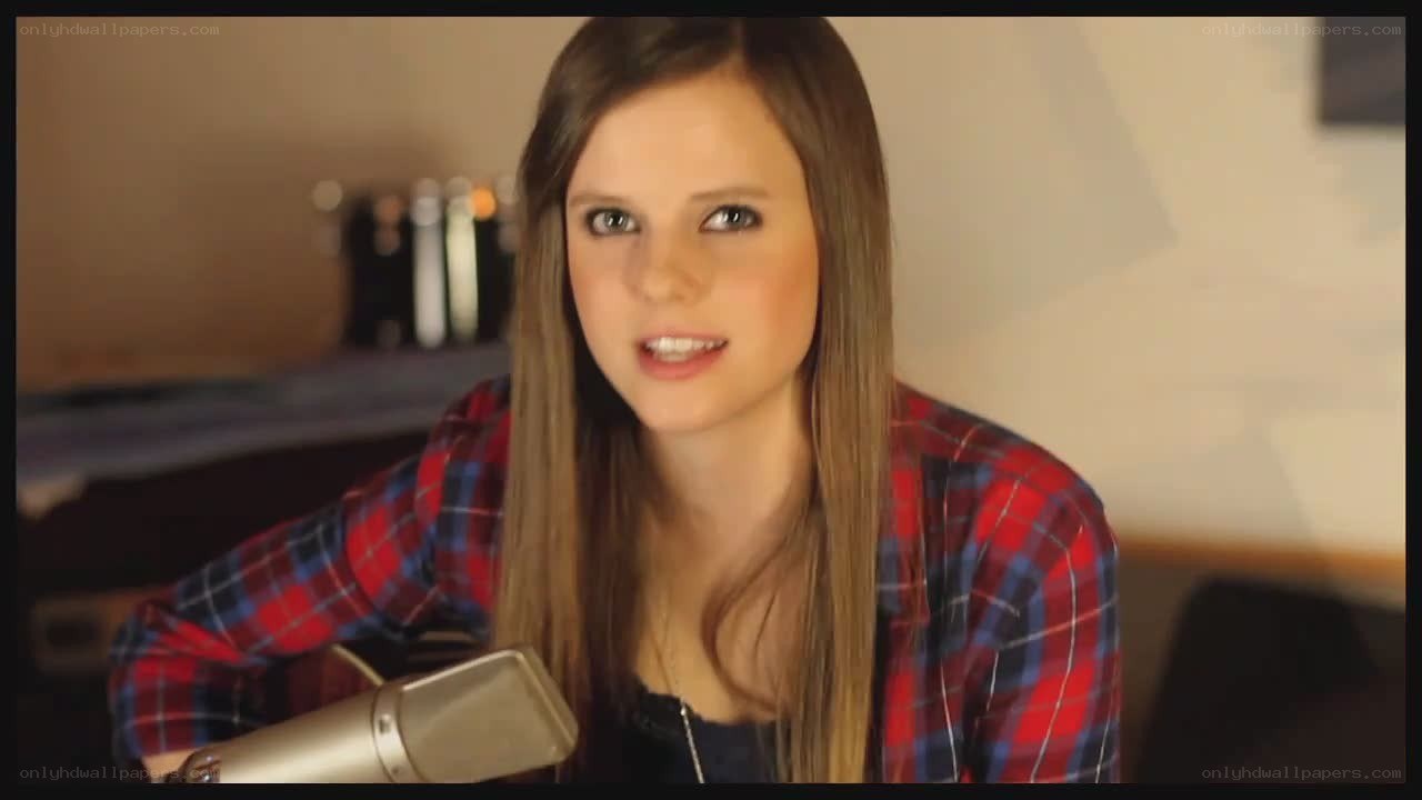 woman singing into microphone