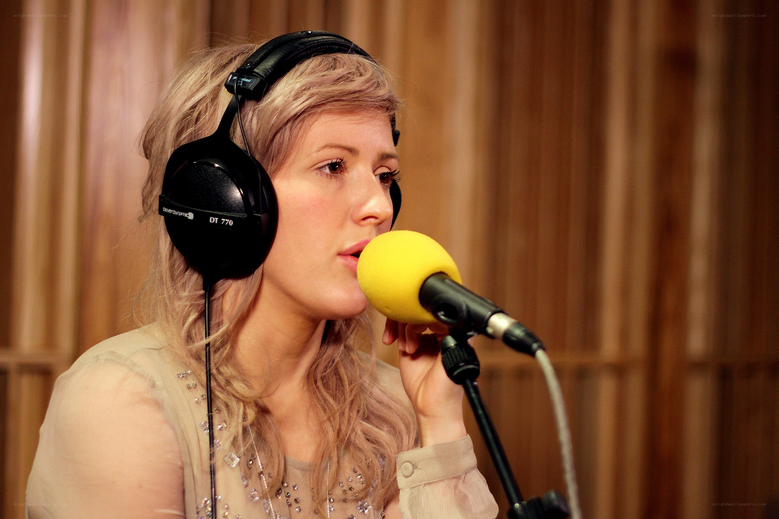 woman singing into microphone