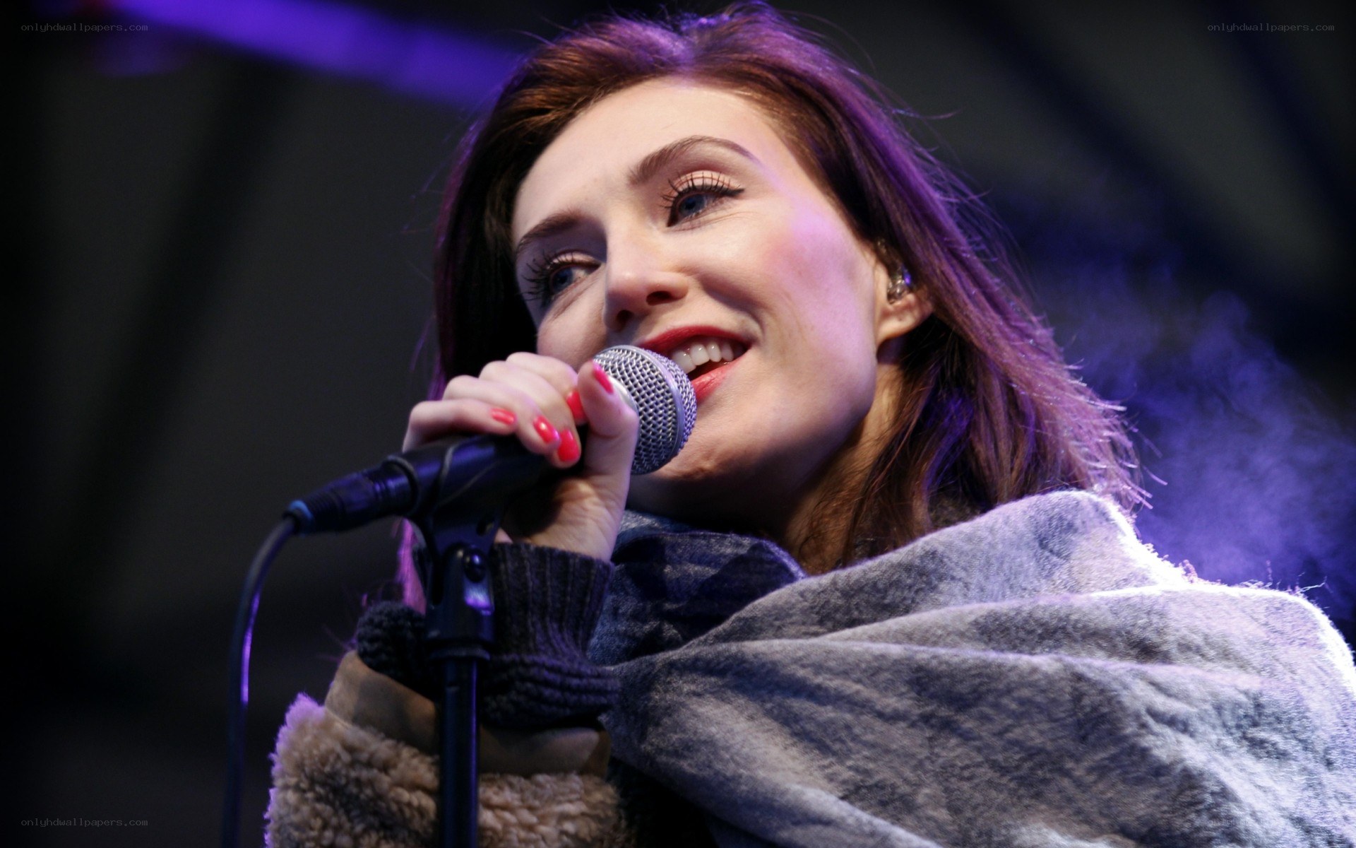 woman singing into microphone