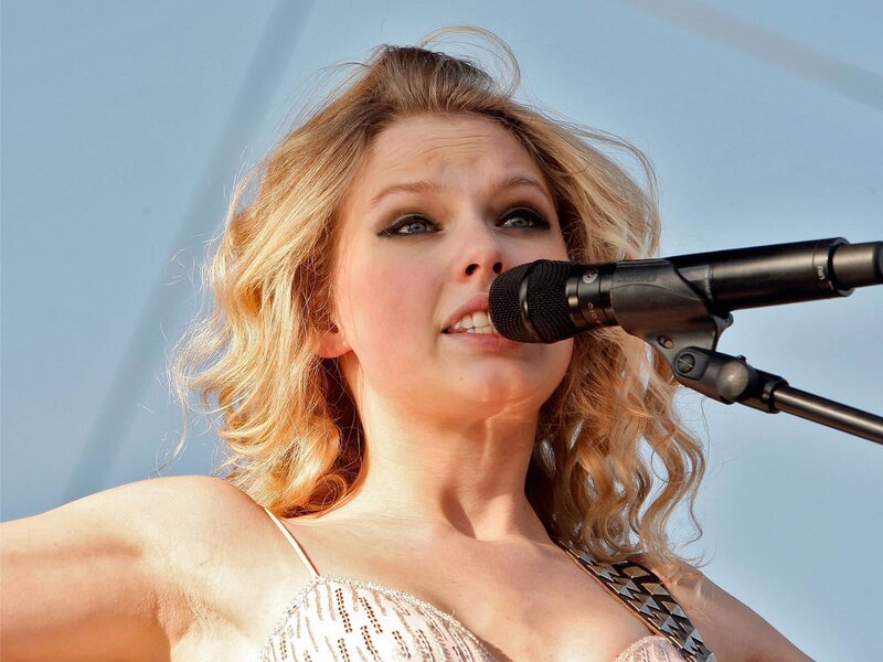 woman singing into microphone