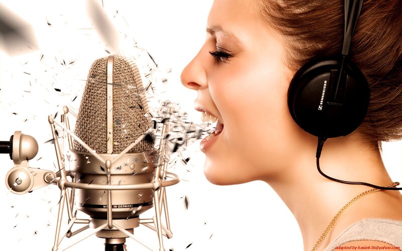 woman singing into microphone