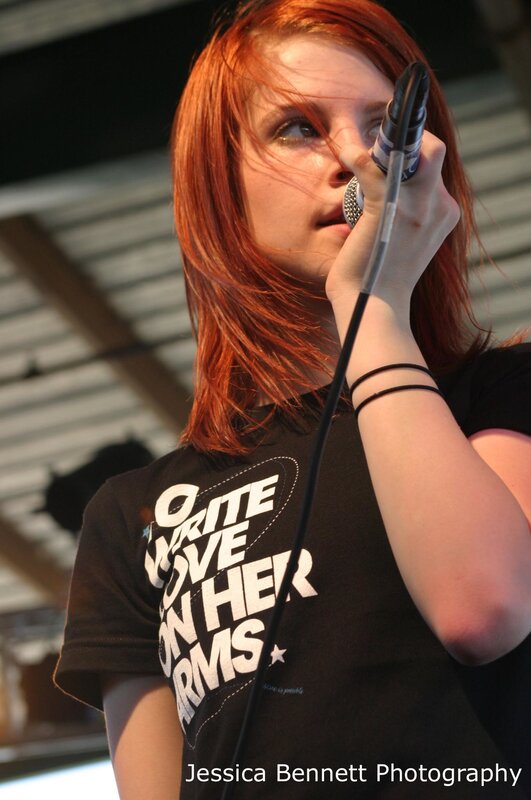 woman singing into microphone