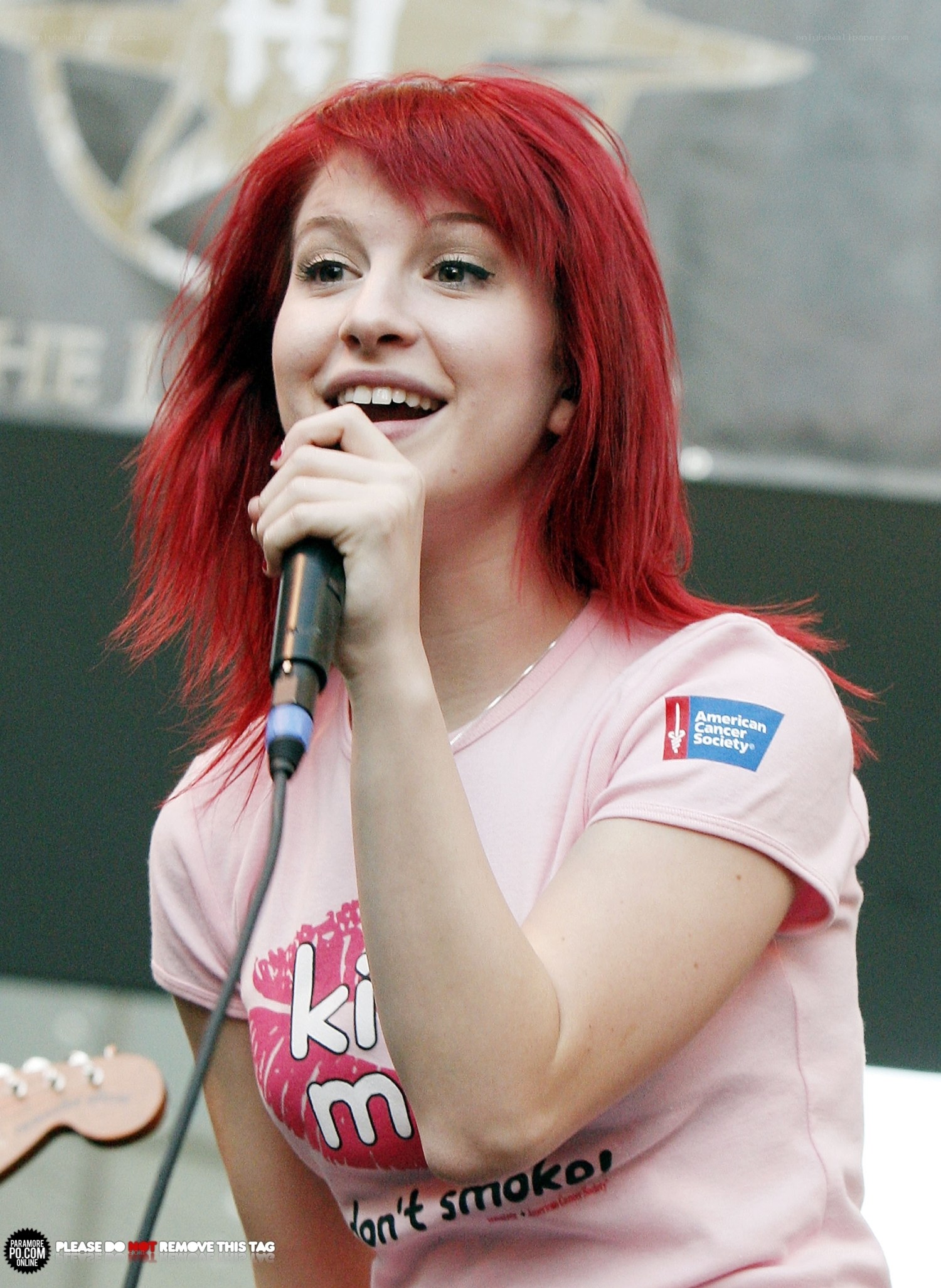 woman singing into microphone