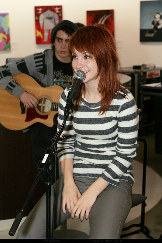 woman singing into microphone