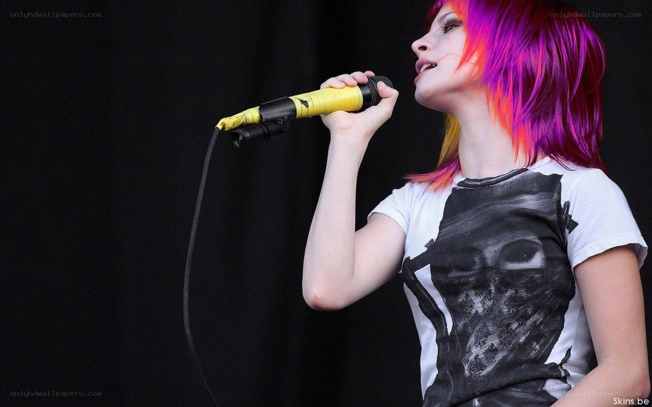 woman singing into microphone