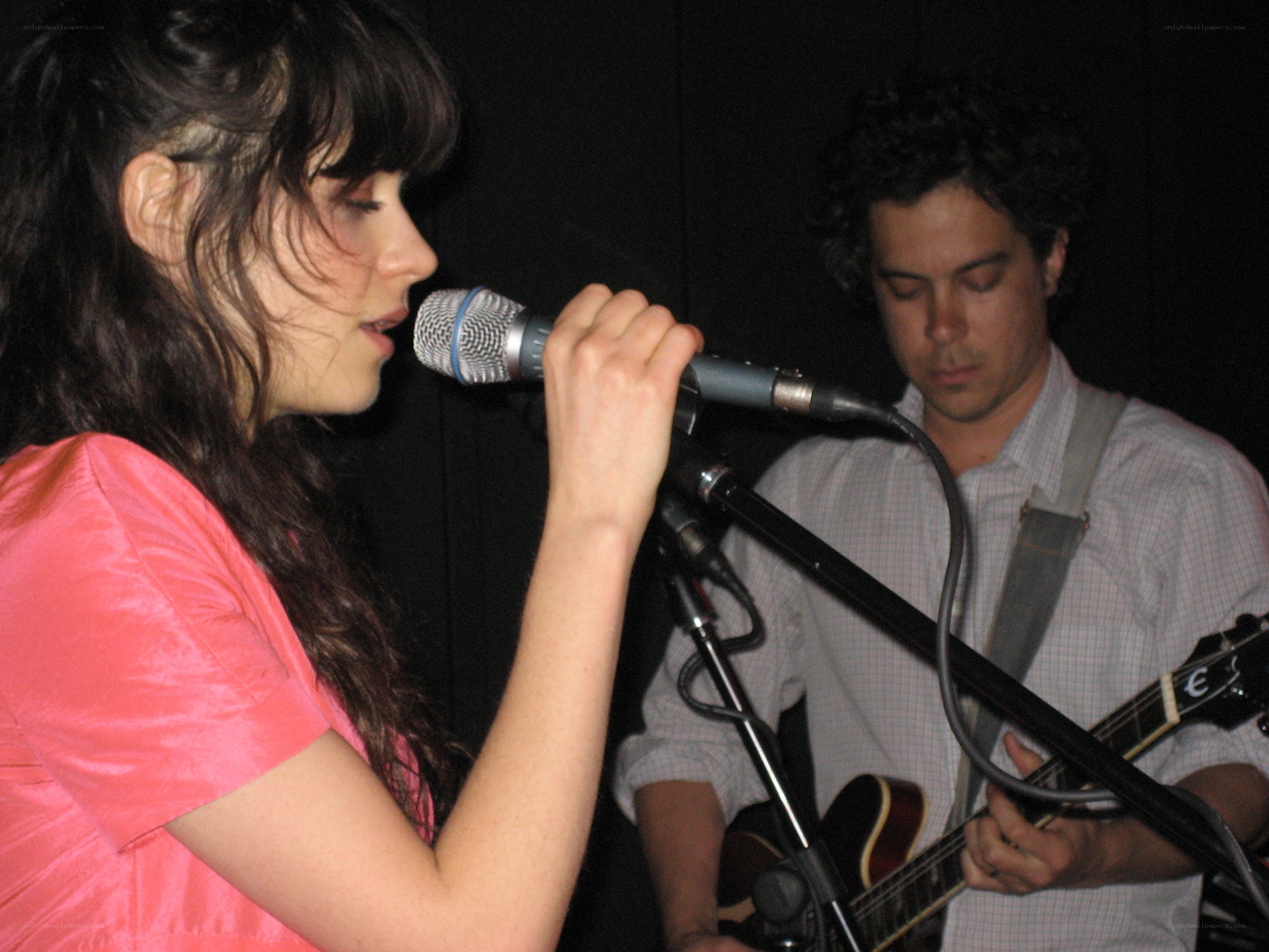 woman singing into microphone