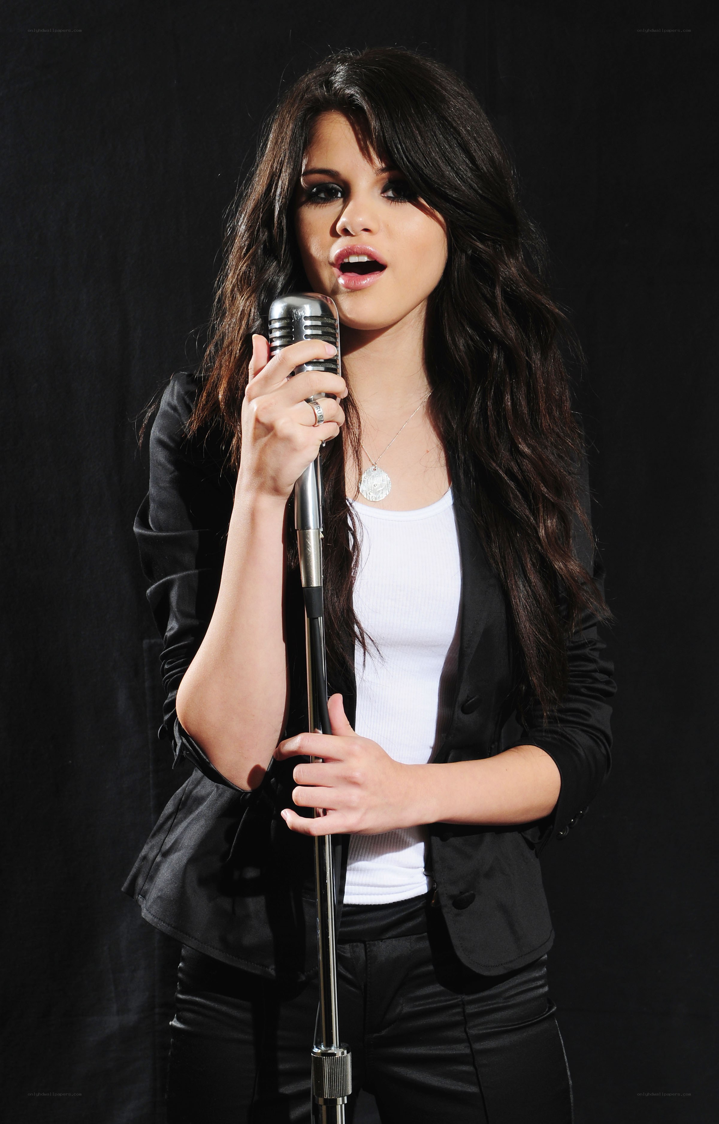 woman singing into microphone