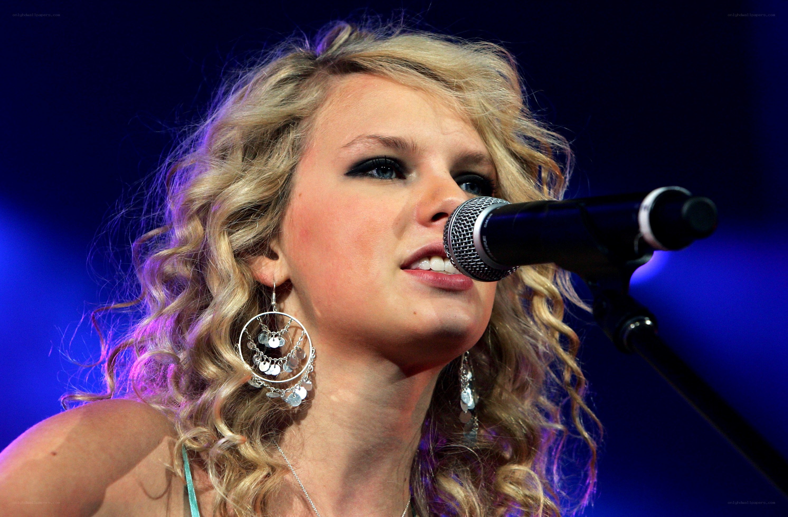 woman singing into microphone