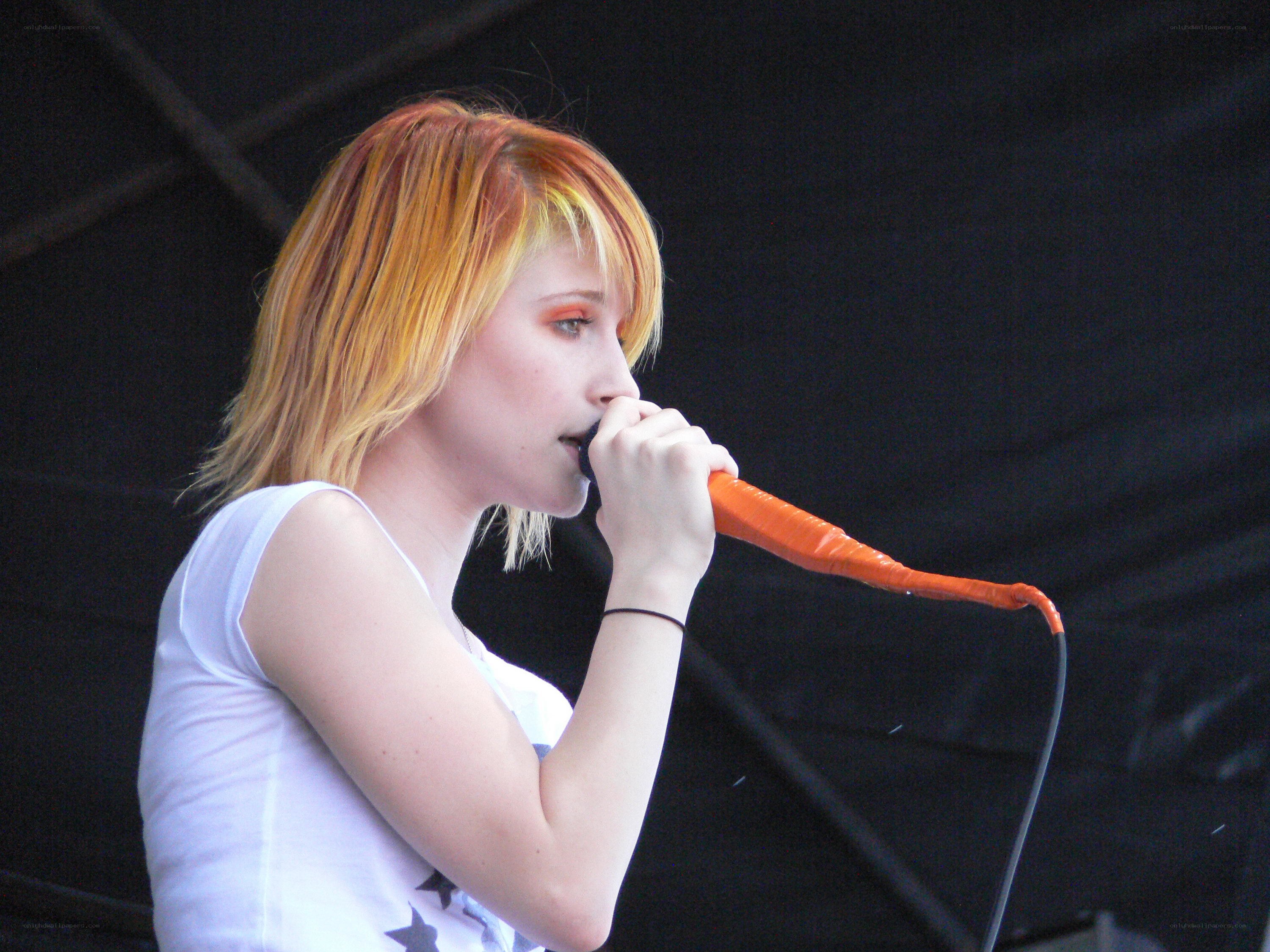 woman singing into microphone