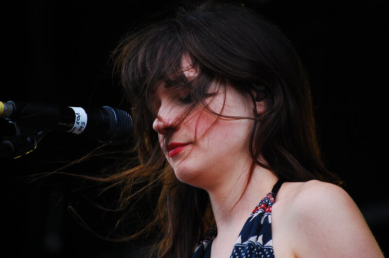 woman singing into microphone