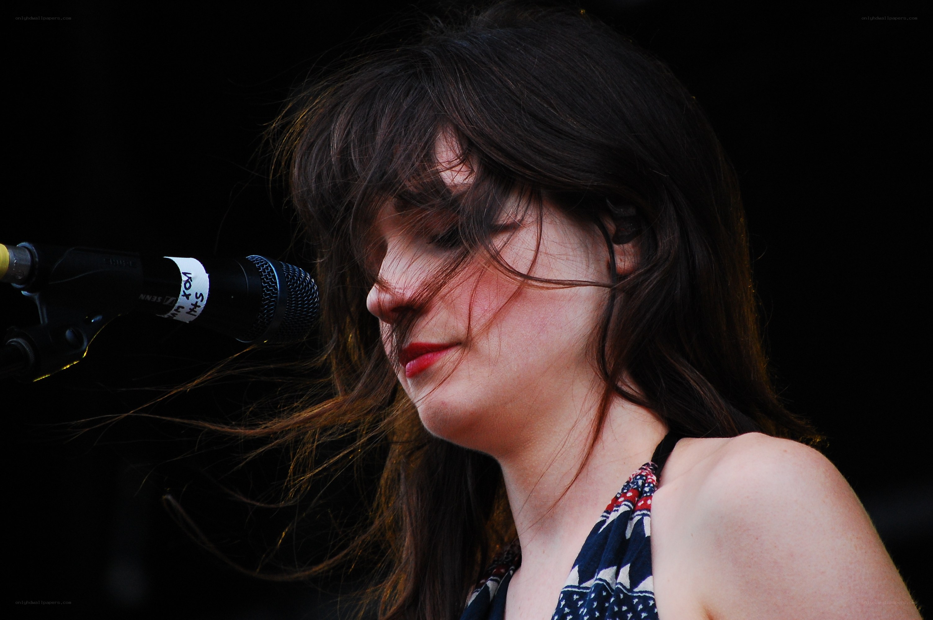 woman singing into microphone