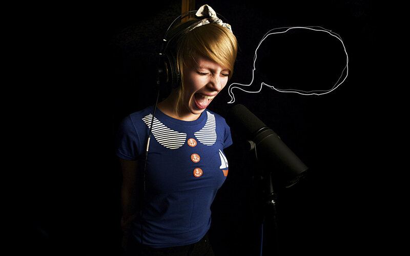 woman singing into microphone