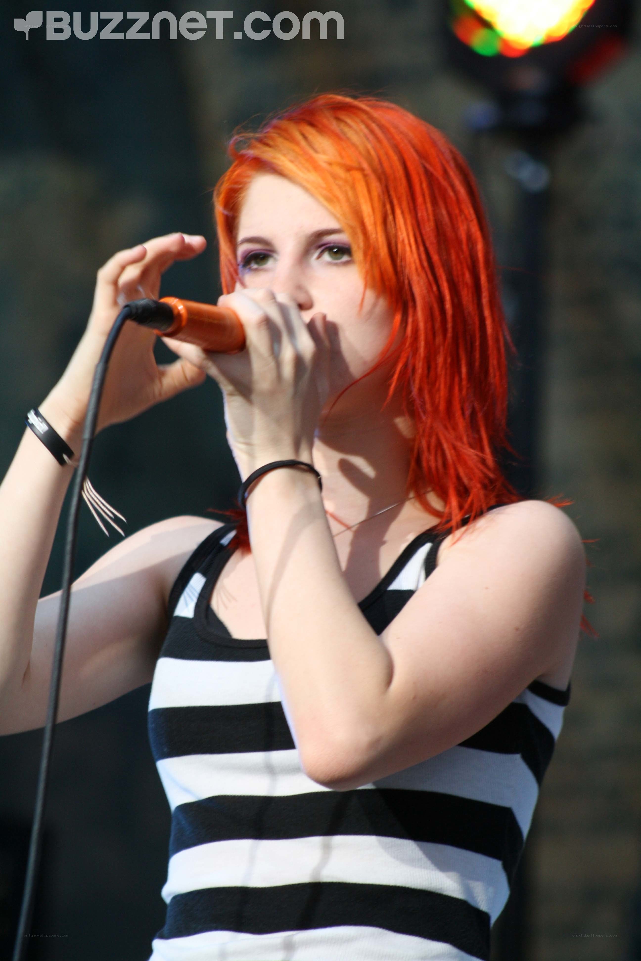 woman singing into microphone
