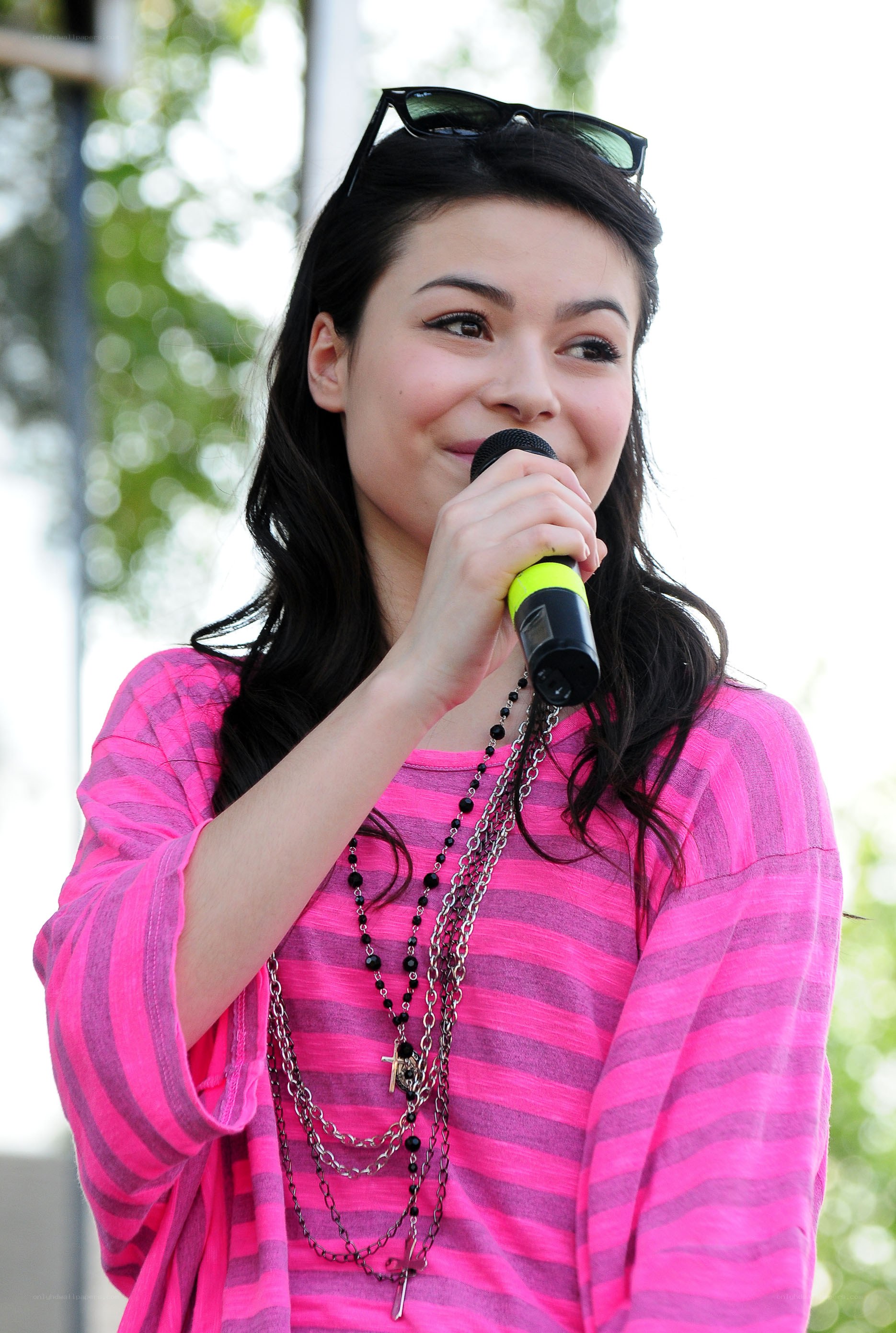 woman singing into microphone