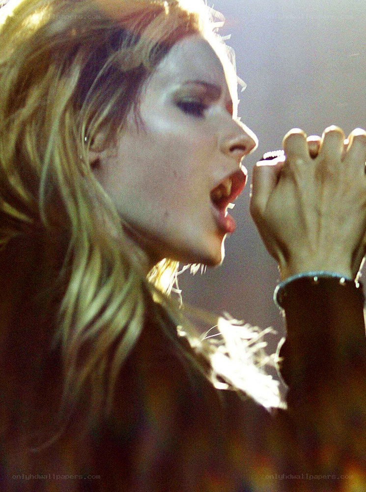 woman singing into microphone