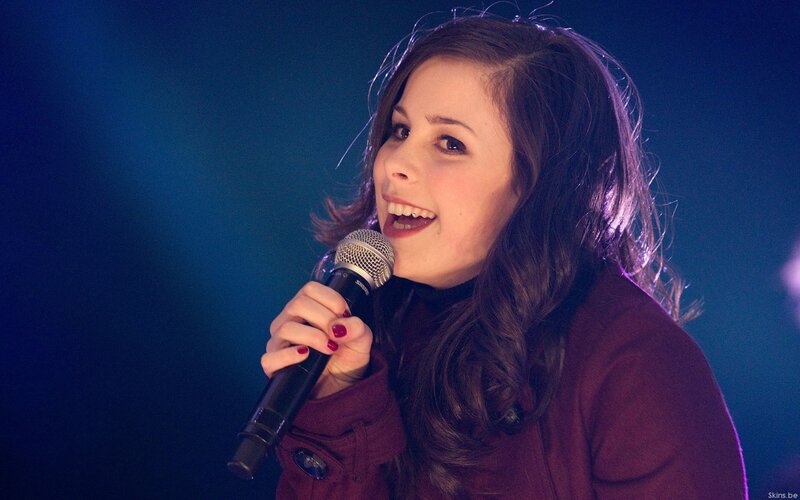 woman singing into microphone