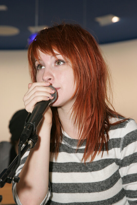 woman singing into microphone