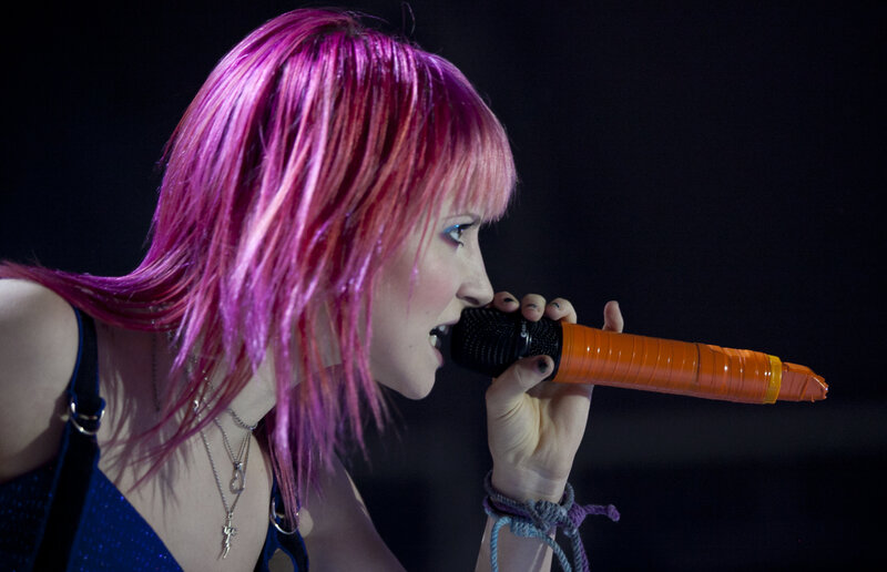 woman singing into microphone