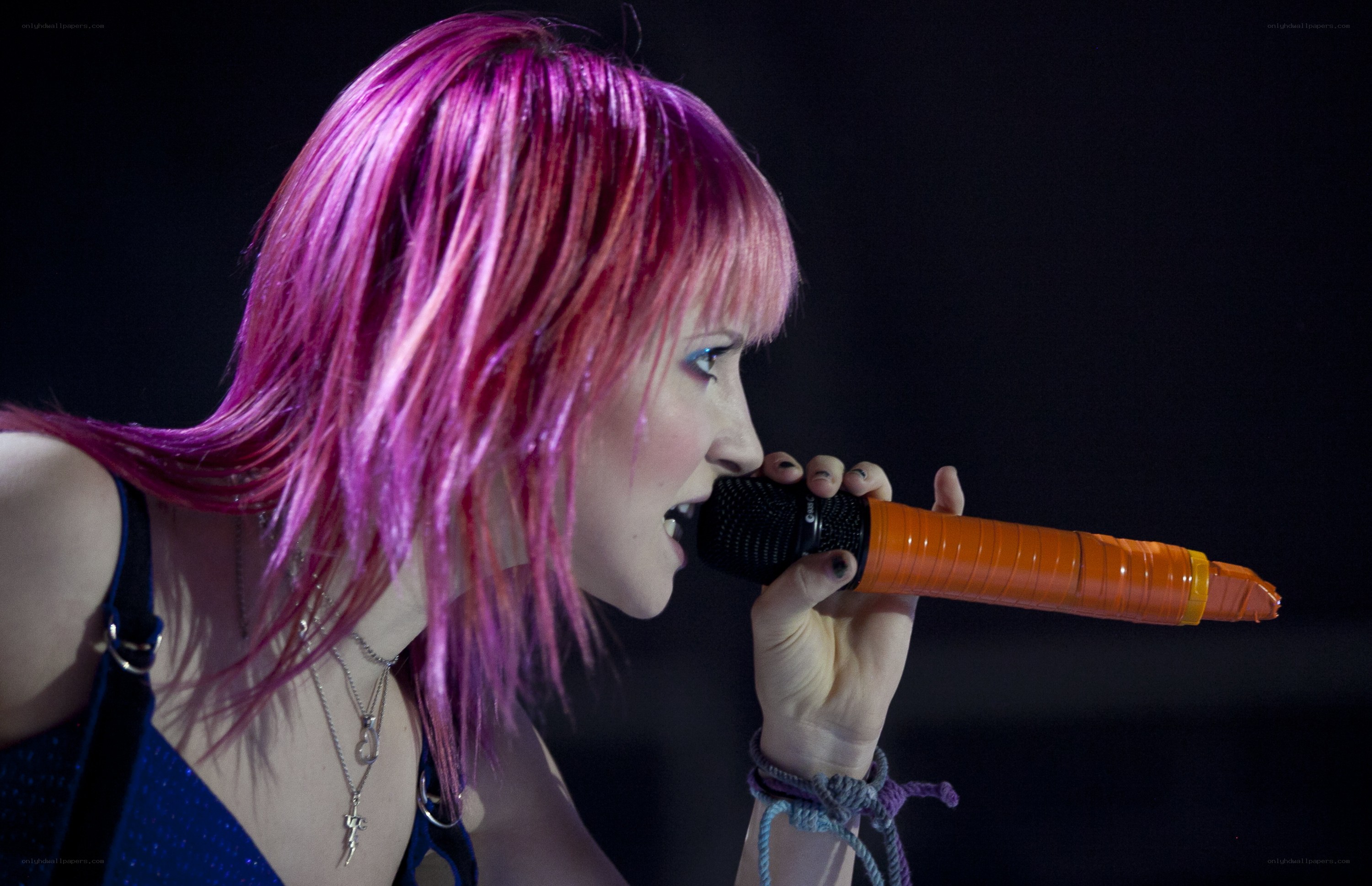 woman singing into microphone