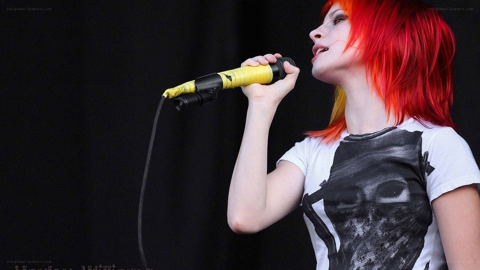 woman singing into microphone