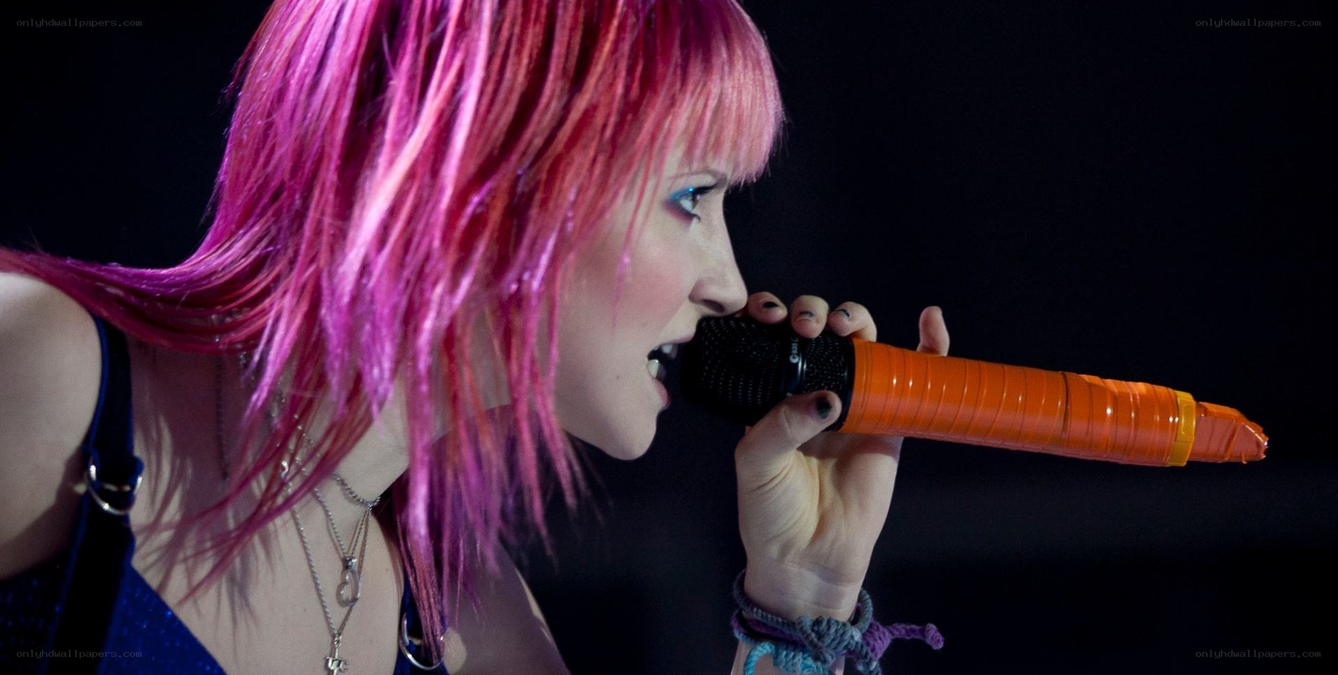 woman singing into microphone