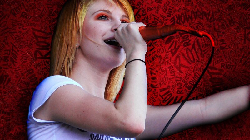 woman singing into microphone