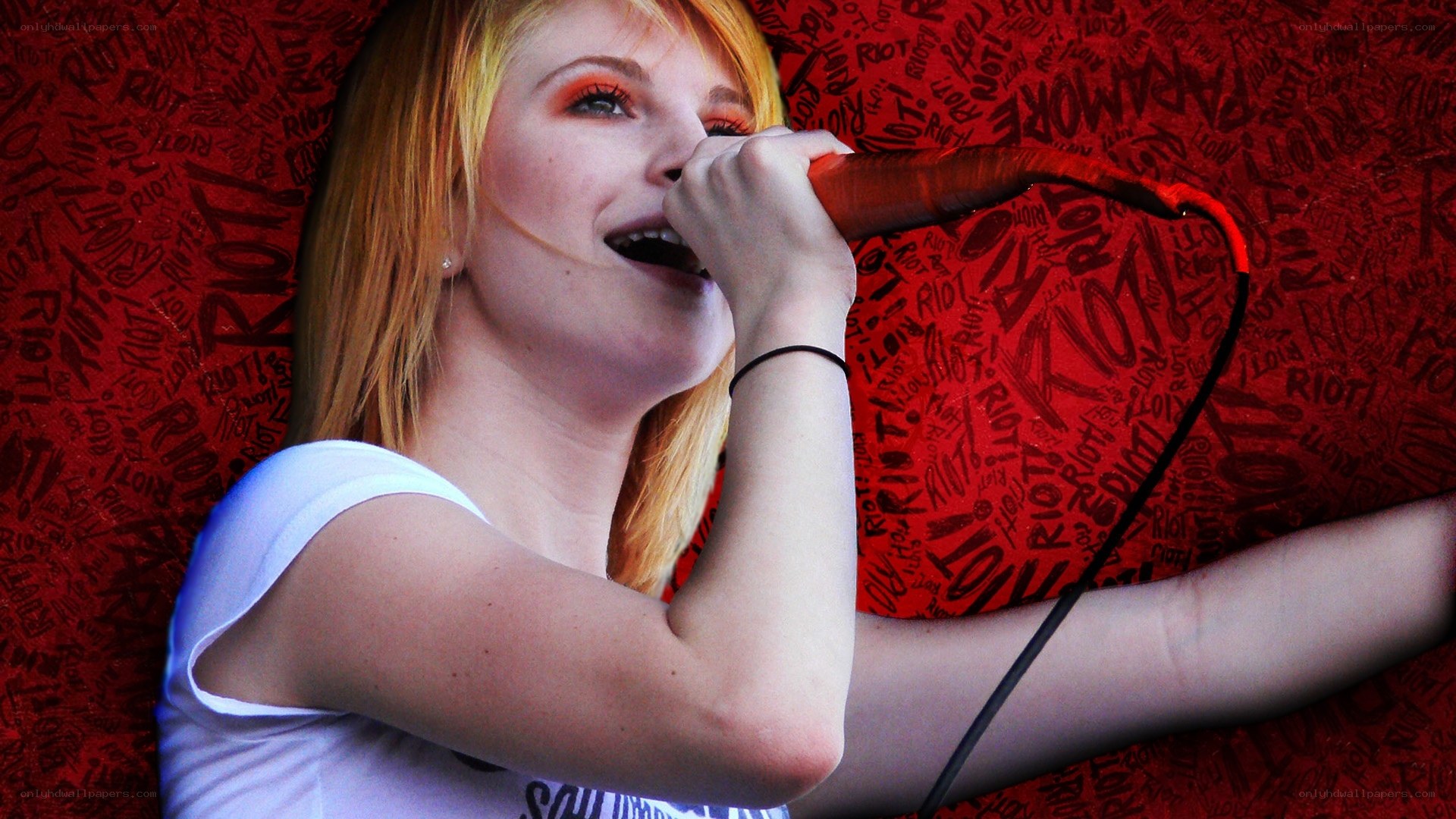 woman singing into microphone
