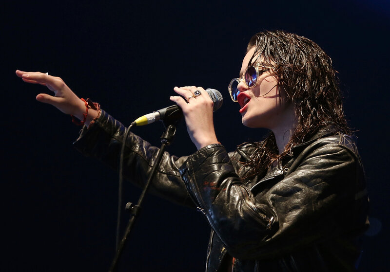 Woman Singing into Microphone — Black, Dramatic, Night, Photograph, Sunglasses