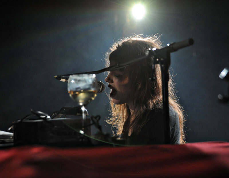 Woman Singing into Microphone — Black, Dramatic, Night