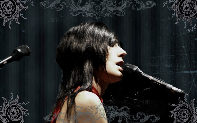 Woman Singing into Microphone — Black, Dramatic, Photograph, Tattoo