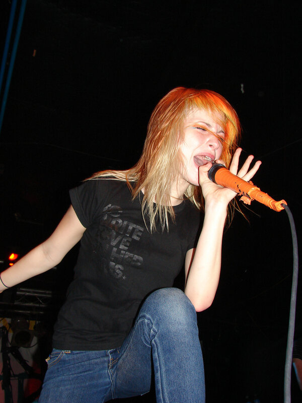 Woman Singing into Microphone — Black, Energetic, Night, Photograph, Jeans