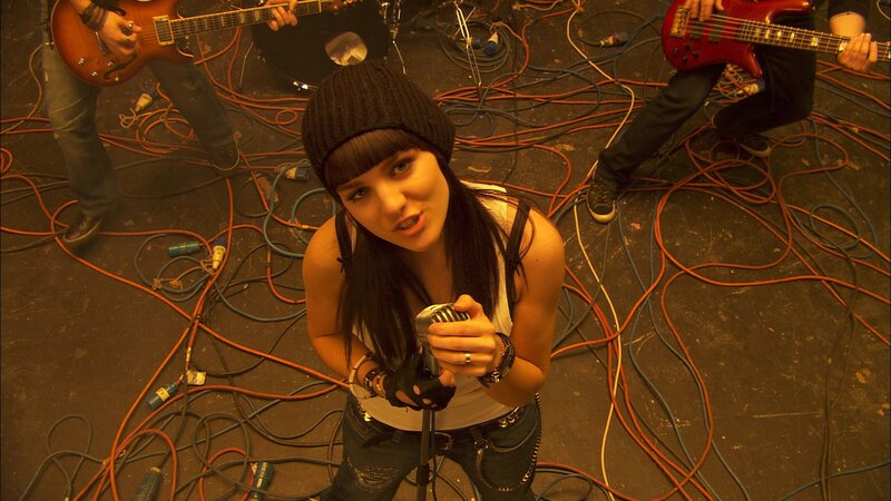 Woman Singing into Microphone — Black, Energetic, Photograph, Band Members