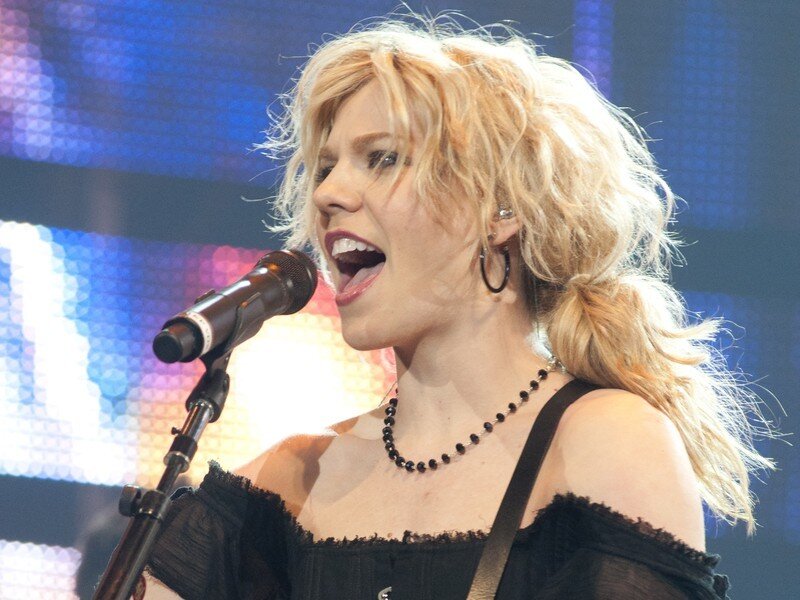 Woman Singing into Microphone — Black, Energetic, Photograph, Necklace