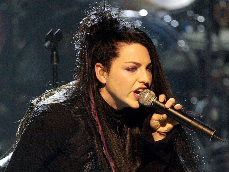 Woman Singing into Microphone — Black, Intense, Photograph, Stage Lights
