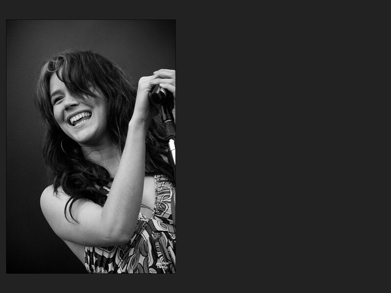 Woman Singing into Microphone — Black, Joyful