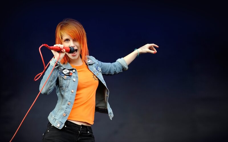 Woman Singing into Microphone — Blue, Energetic, Photograph