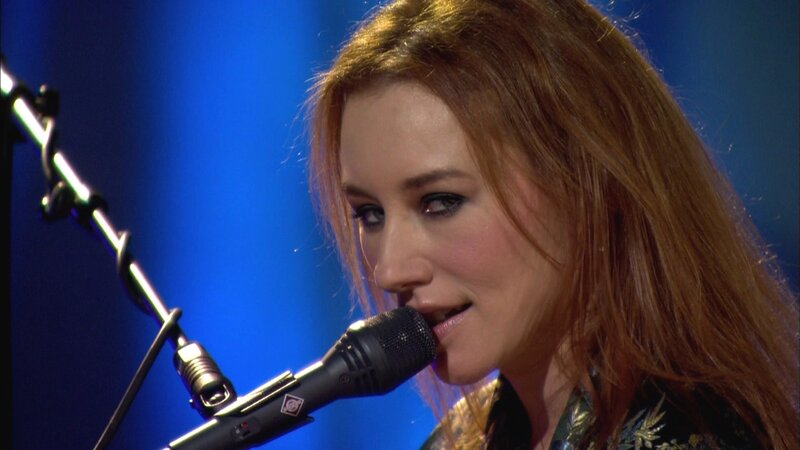 Woman Singing into Microphone — Blue, Focused, Photograph