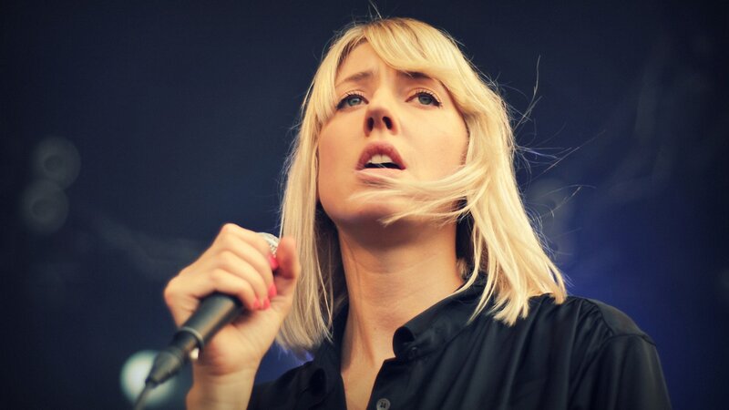 Woman Singing into Microphone — Blue, Intense