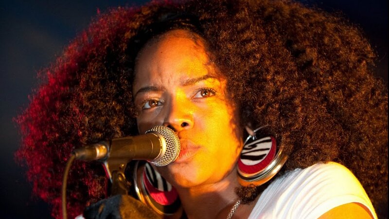 Woman Singing into Microphone — Brown, Dramatic, Night
