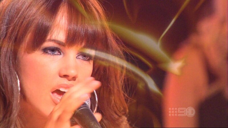 Woman Singing into Microphone — Brown, Dramatic, Photograph, Earring