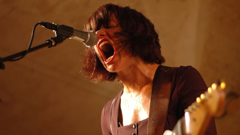Woman Singing into Microphone — Brown, Intense