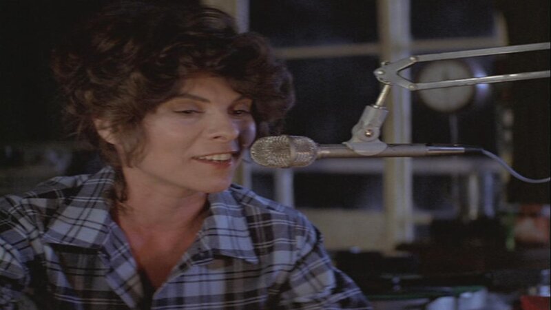 Woman Singing into Microphone — Gray